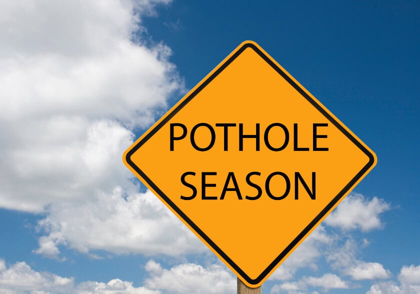 Potholes season sign